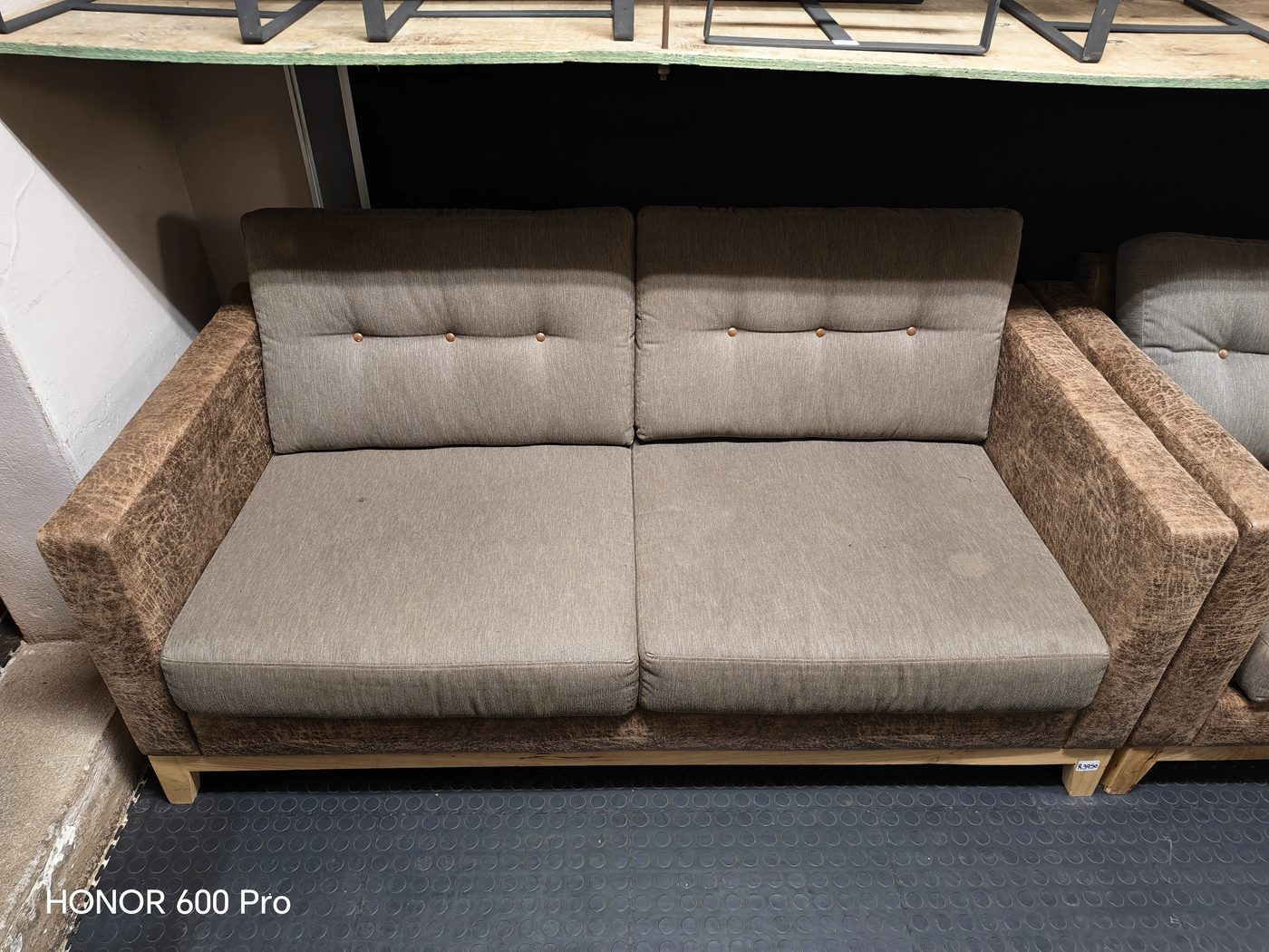 Second-hand brown two-seater couches