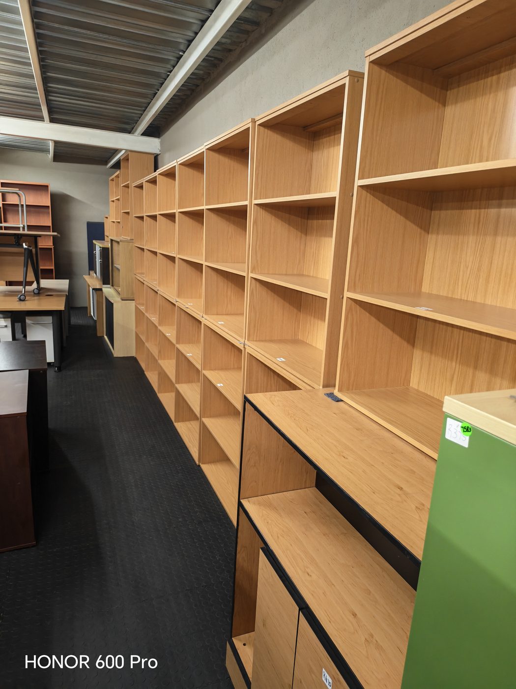 Second-hand oak bookshelves wall