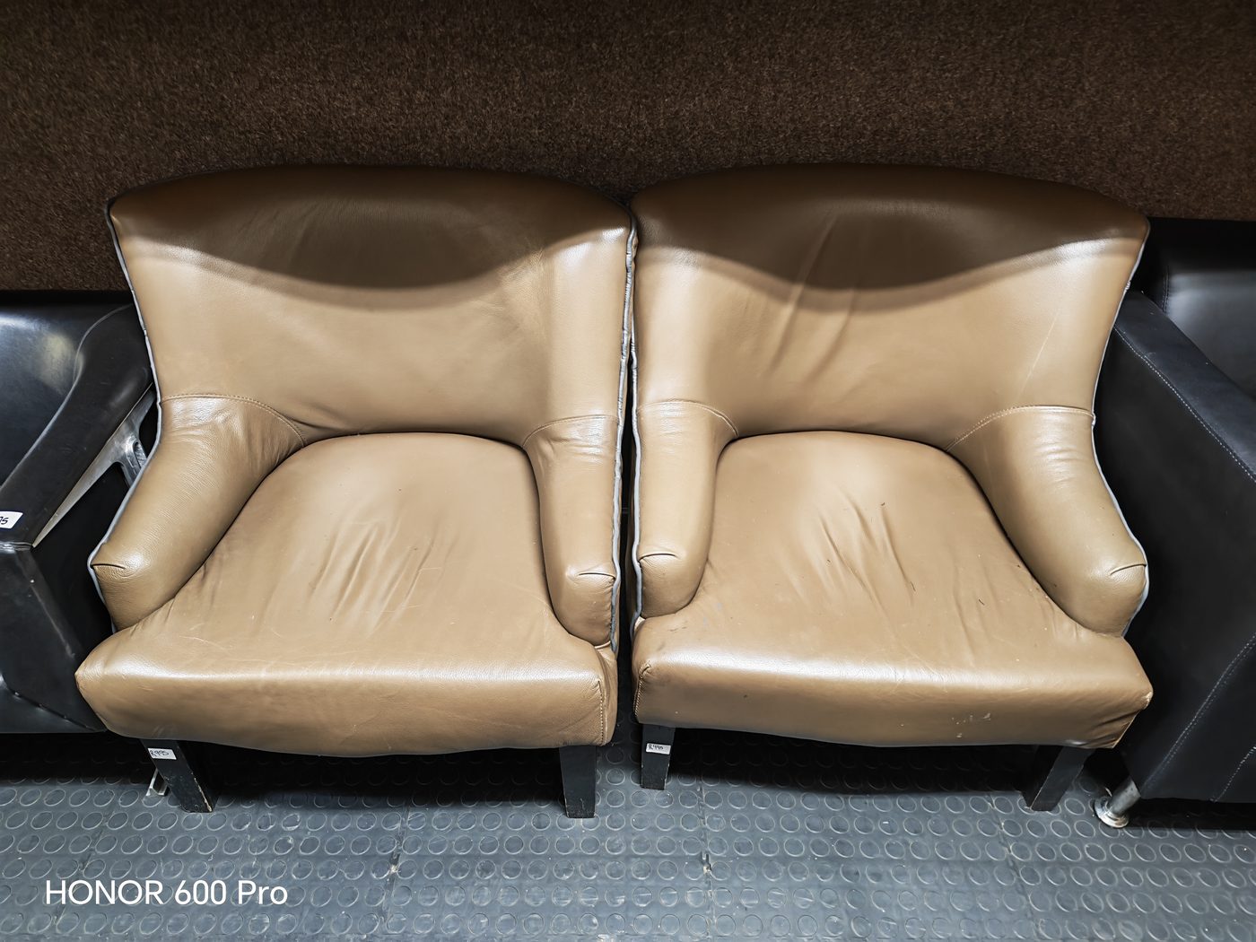 Second-hand tan leather tub chairs