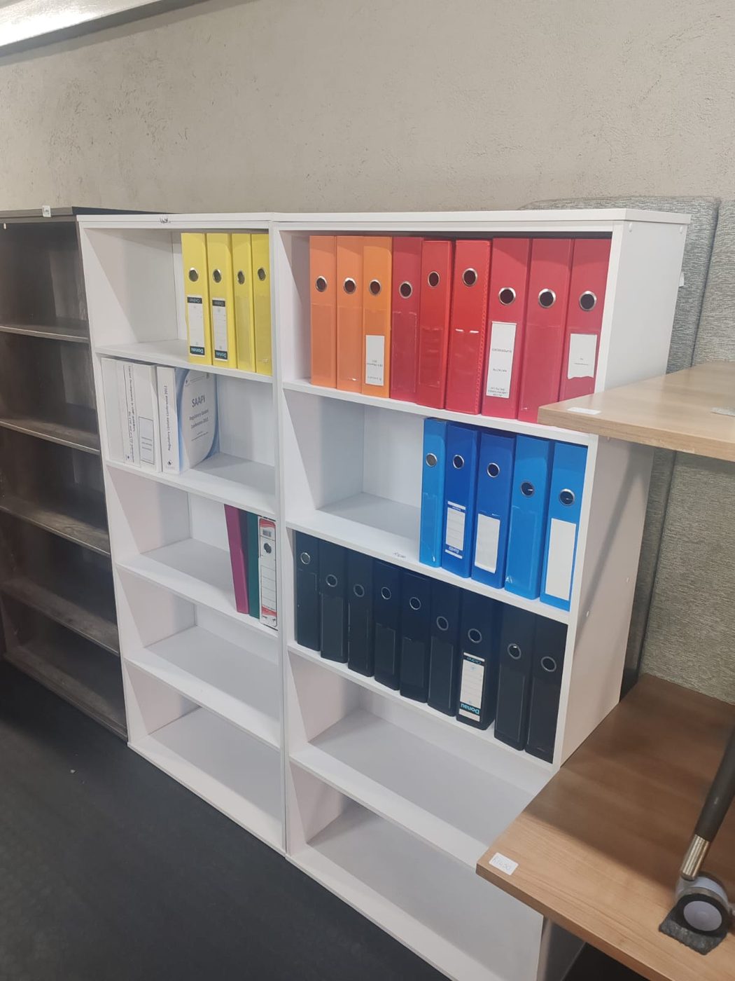 Second-hand white bookshelves