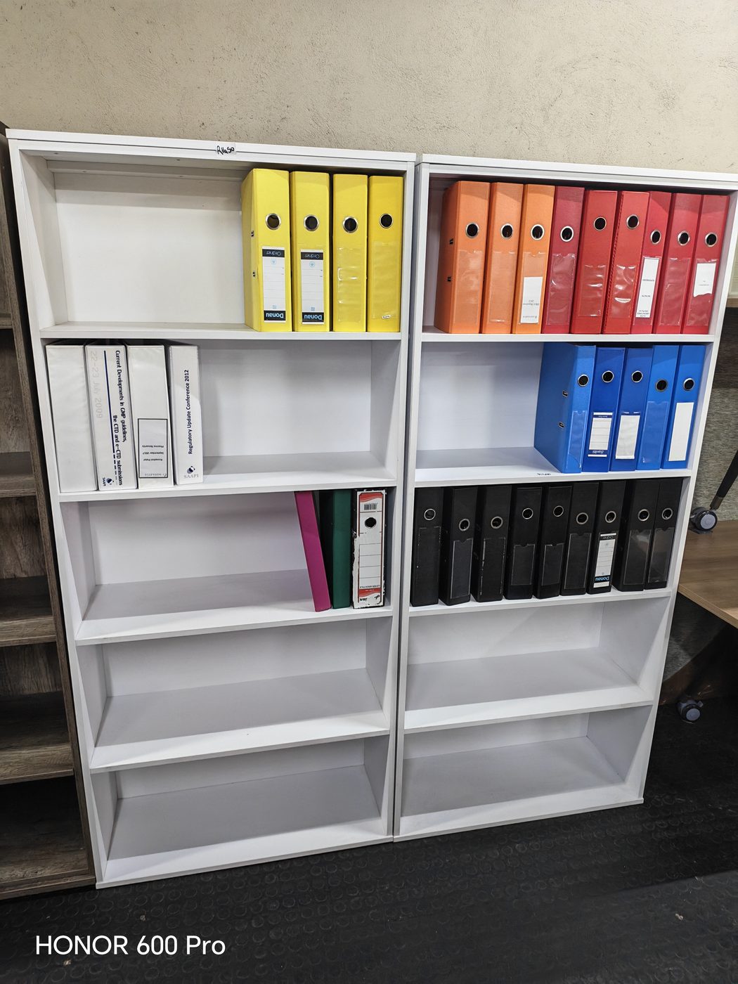 Second-hand white bookshelf pair